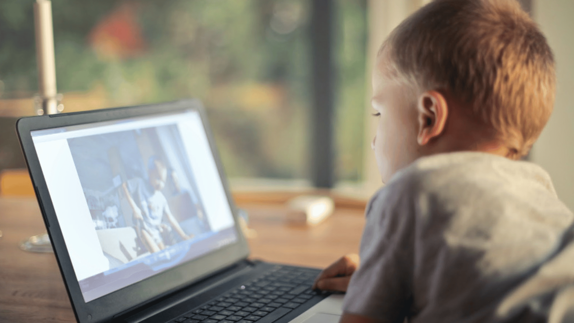 Child looking at laptop screen