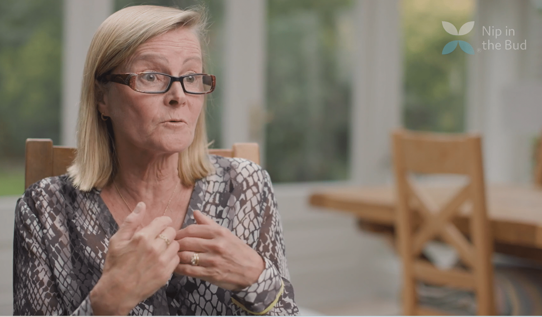 A mother talks to an interviewer