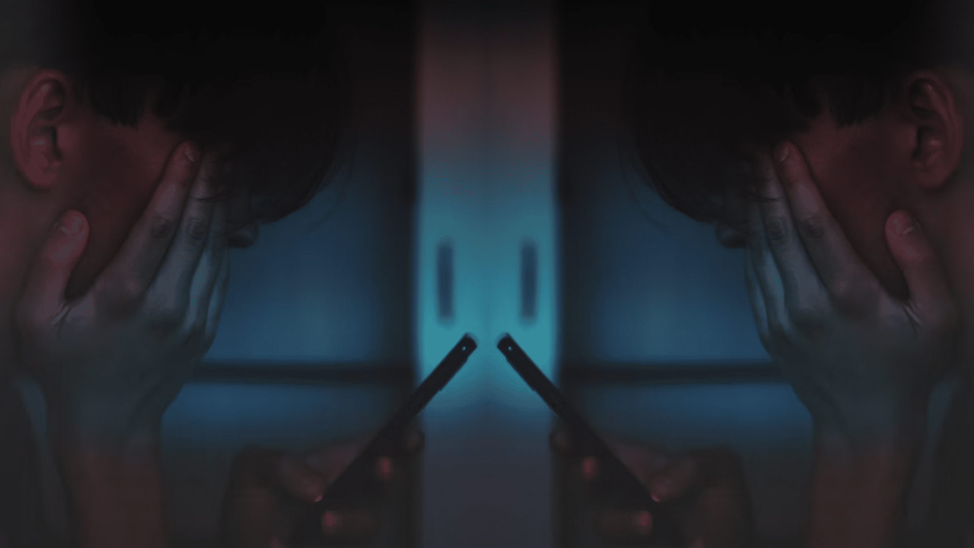 An image of a child looking at a smart phone is reflected